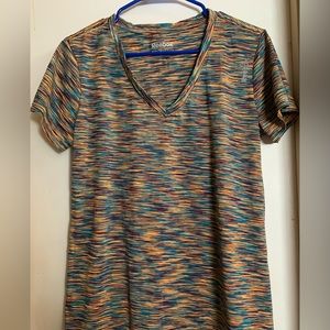 Reebok activewear top. Multi color in tone of orange, purple and teal.